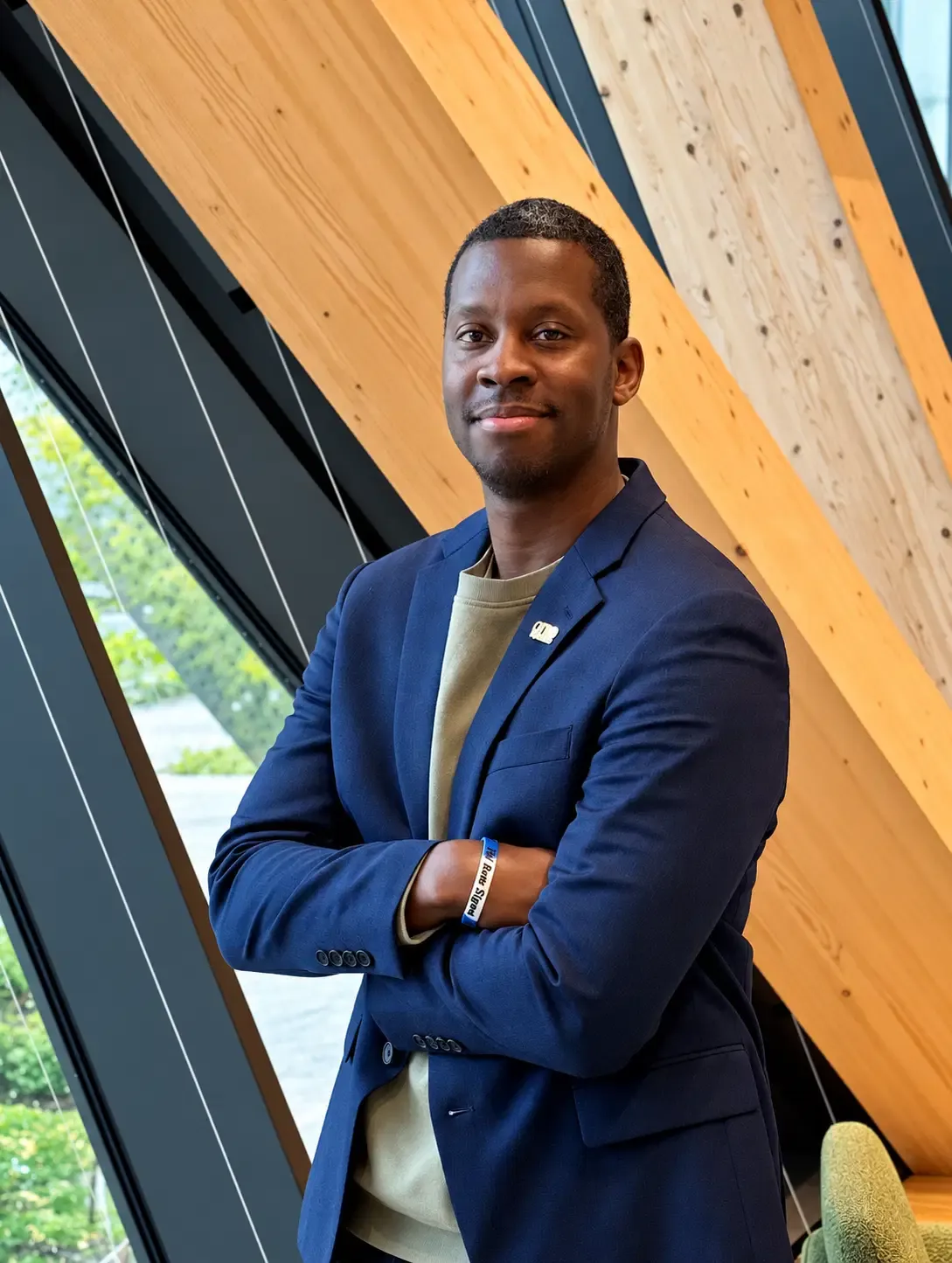 Robert S. Rivers in a navy blazer in a bright modern interior